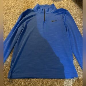 Nike Dri-FIT Superset men's quarter-zip training top in a blue colorway.
